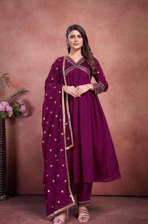 Women Anarkali kurta , pant with heavy dupatta.