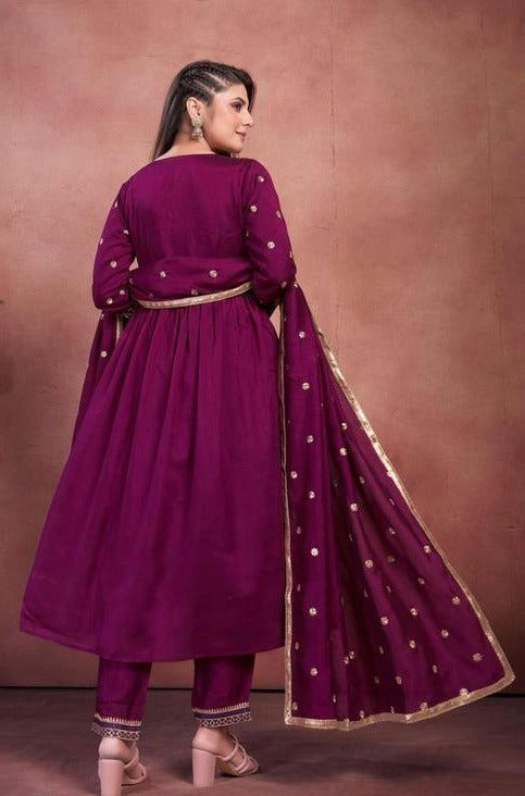 Women Anarkali kurta , pant with heavy dupatta.