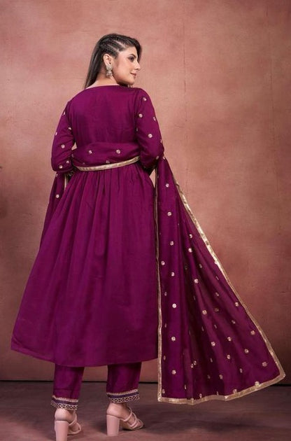 Women Anarkali kurta , pant with heavy dupatta.